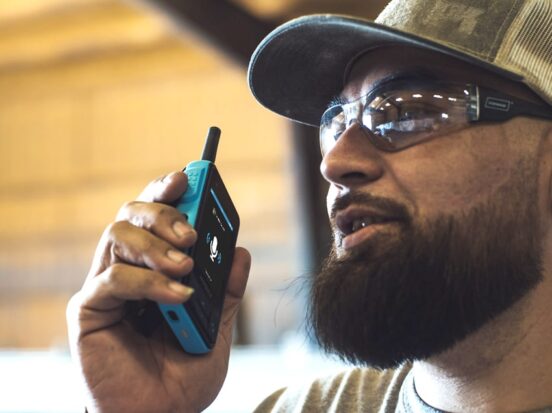 Image of a worker equipped with an industrial radio.