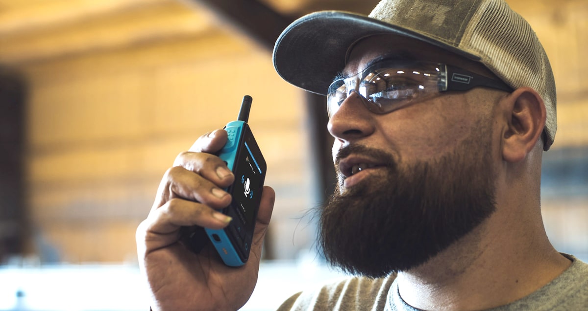 Image of a worker equipped with an industrial radio.