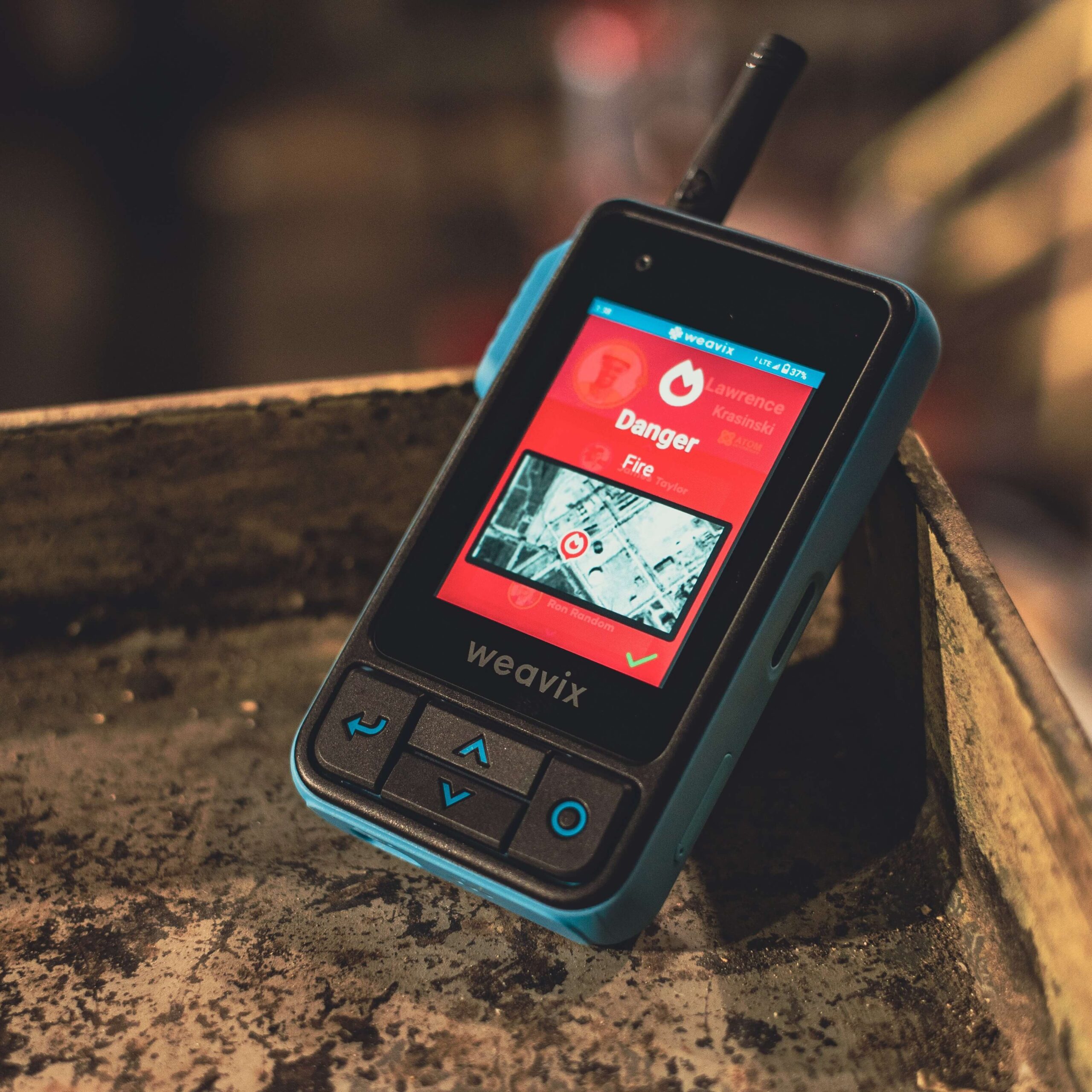 Thumbnail for a blog post on five ways a mass notification system improves worker safety, showing a Walt Smart Radio displaying an alert for danger from fire.