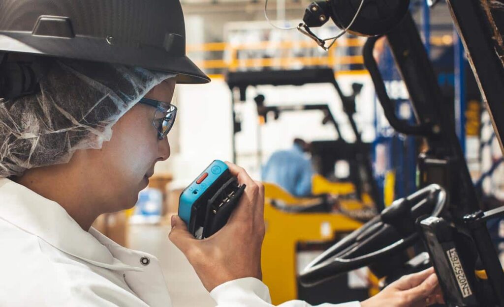 Woman using a Walt Smart Radio to communicate