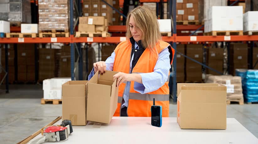 Warehouse worker sorting out boxes