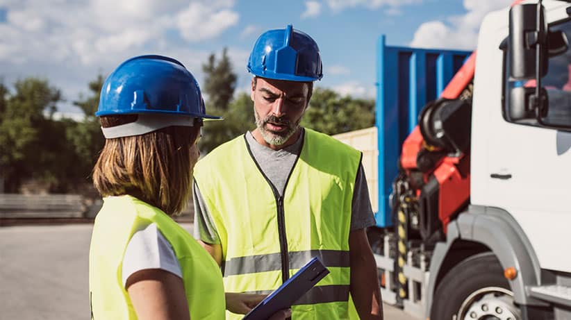 Two frontline workers talking