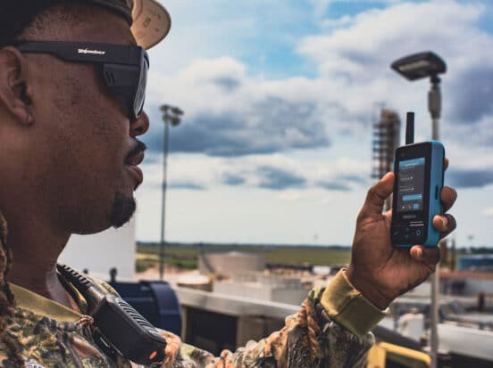 Frontline worker reading messages on a Walt Smart Radio by weavix