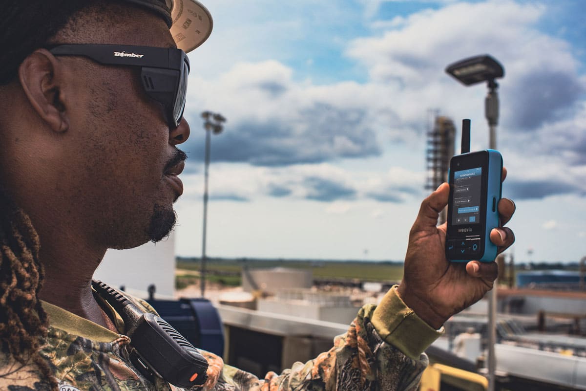 Frontline worker reading messages on a Walt Smart Radio by weavix