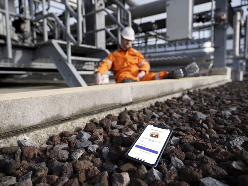 Frontline worker exhausted from using a mobile phone
