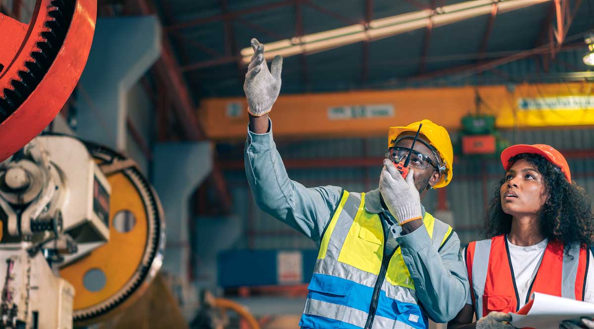 Factory workers responding to communication breakdown during plant emergency