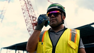 Frontline worker using a Walt Smart Radio to communicate