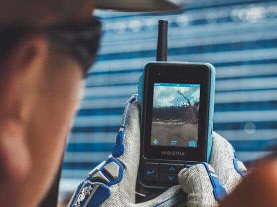 Construction worker taking a picture with the Walt Smart Radio