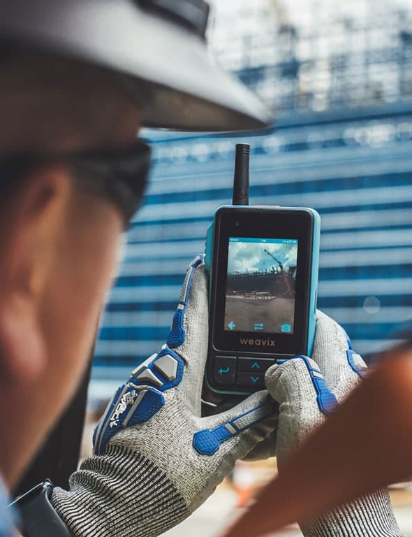 Construction worker taking a picture with the Walt Smart Radio